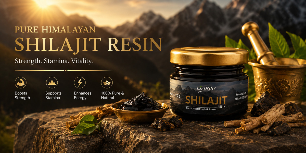 "A small glass jar of Oribite Pure Himalayan Shilajit Resin placed on a rustic wood piece next to a golden mortar and pestle, with scenic mountain peaks in the background."