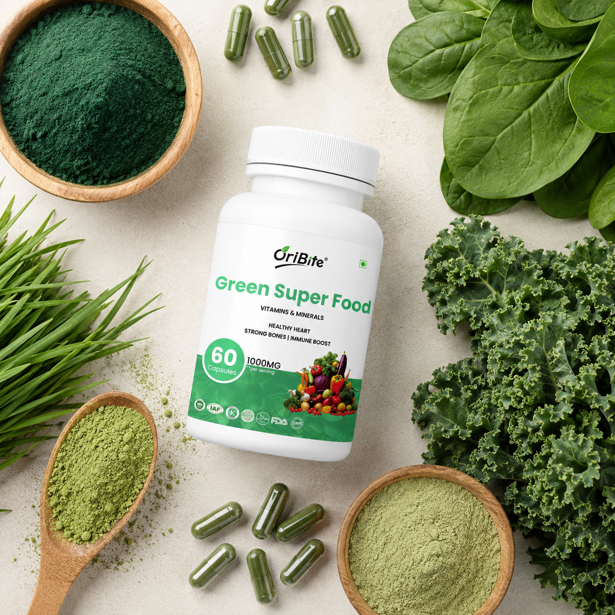 "A white bottle of Oribite Green Super Food Capsules surrounded by bowls of green powder, spilled capsules, wheatgrass, and fresh spinach leaves on a light surface."