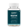 A bottle of OriBite Biotin 10000mcg dietary supplement, featuring a dark teal label and a white cap, containing 60 vegan capsules.