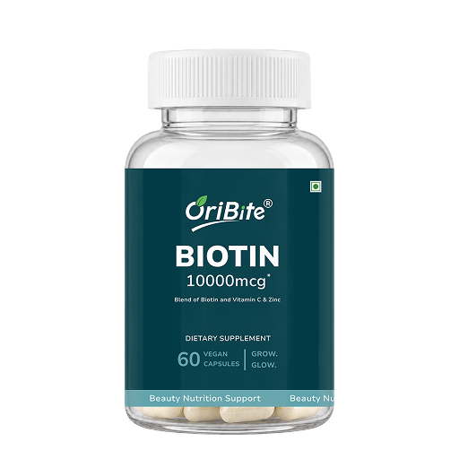 A bottle of OriBite Biotin 10000mcg dietary supplement, featuring a dark teal label and a white cap, containing 60 vegan capsules.