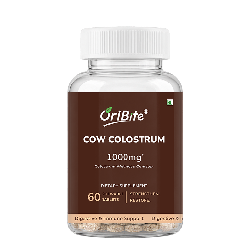 A clear plastic bottle of OriBite Cow Colostrum 1000mg dietary supplement with a white ribbed cap and a brown label, containing 60 chewable tablets visible at the bottom, on a white background.
