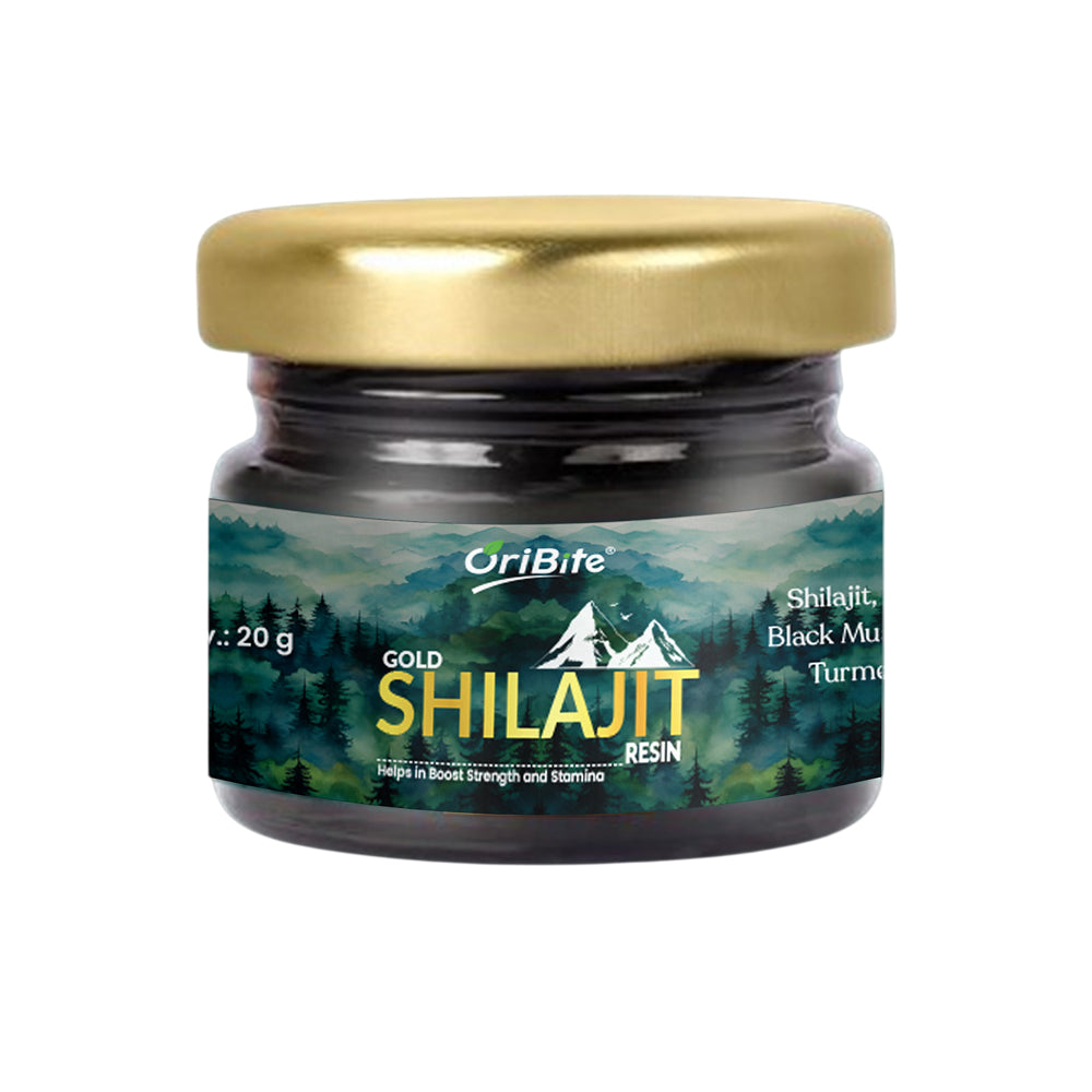 A 20g glass jar of OriBite Gold Shilajit Black Mu Turmeric resin, featuring a metallic gold lid and a forest-themed label, set against a plain white background.
