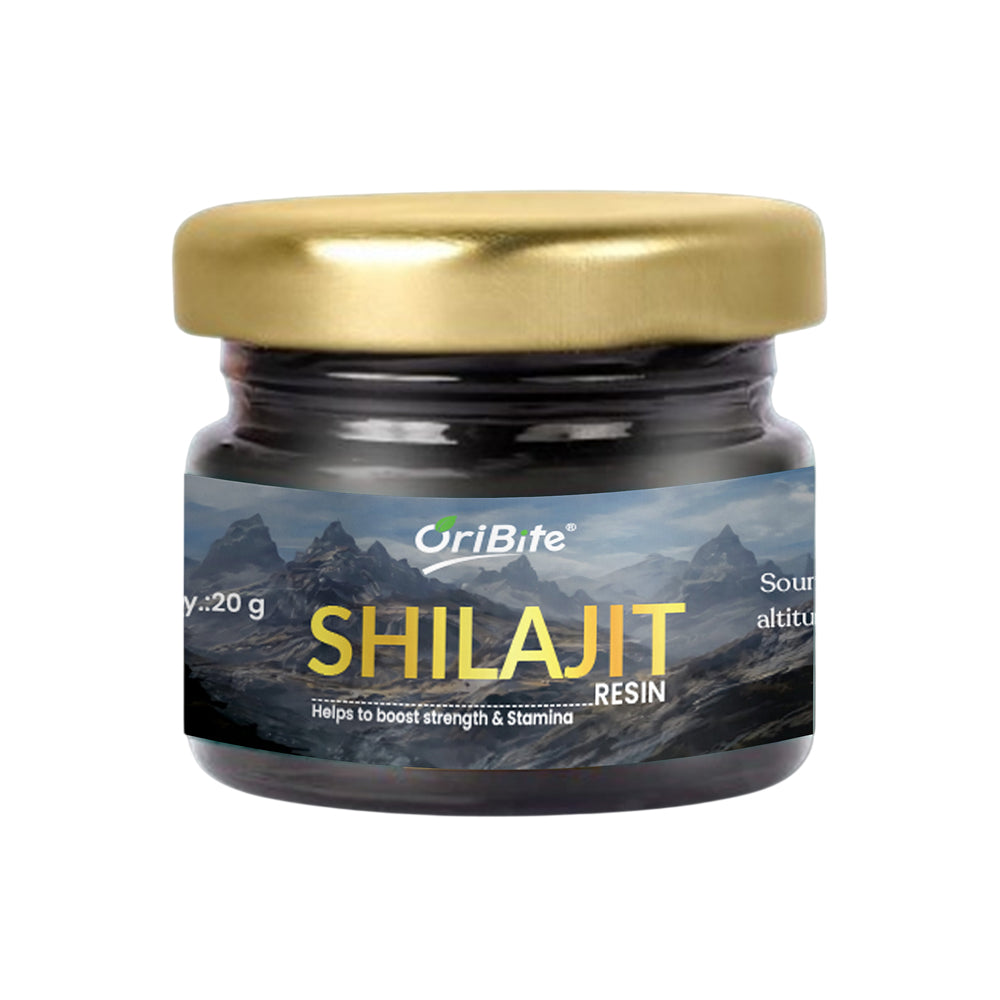 A small glass jar of OriBite Shilajit Resin with a metallic gold lid and a dark mountain-themed label, shown on a plain white background.