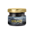 Oribite Shilajit Resin 20g in a dark glass jar with a gold lid, featuring a Himalayan mountain label and the text “Shilajit Resin,” a natural wellness product marketed to support strength and stamina.
